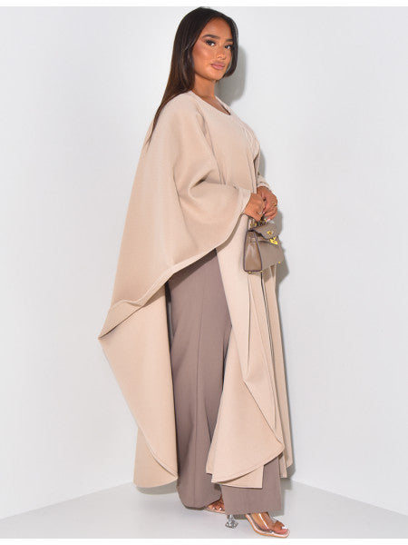 Long cape in textured fabric